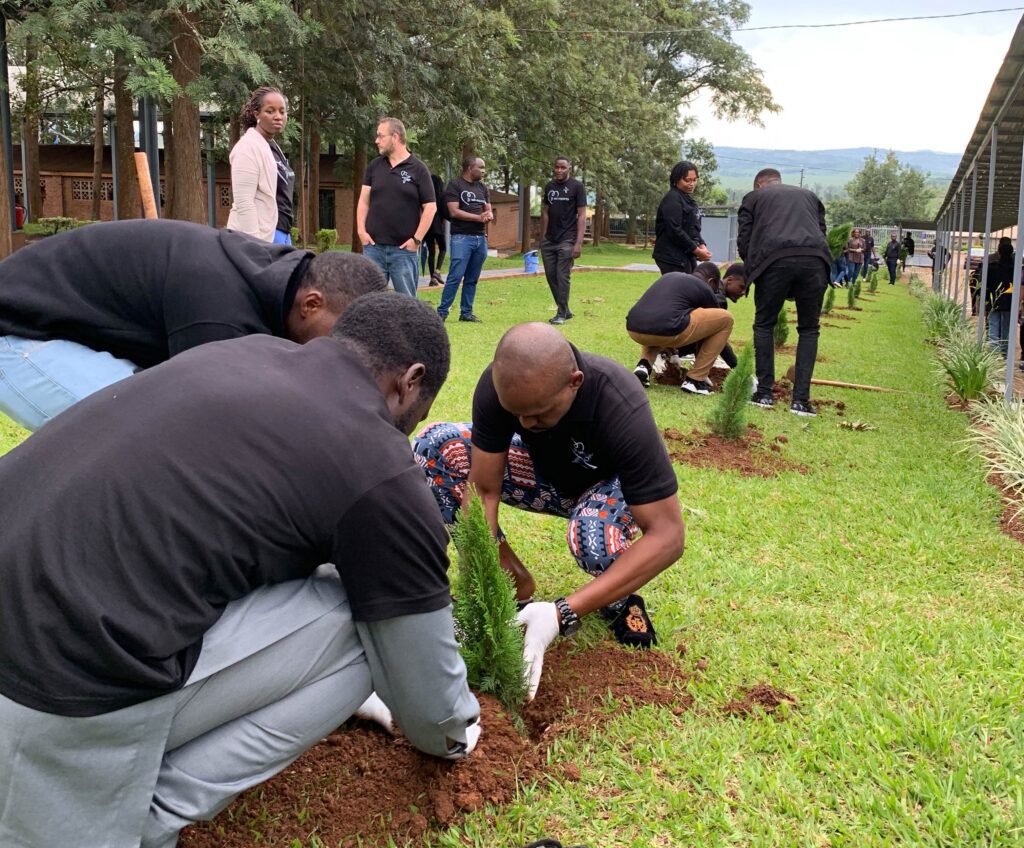 Tek Experts Rwanda volunteers plant trees at the Ntarama Genocide Memorial for Good Deeds Day.